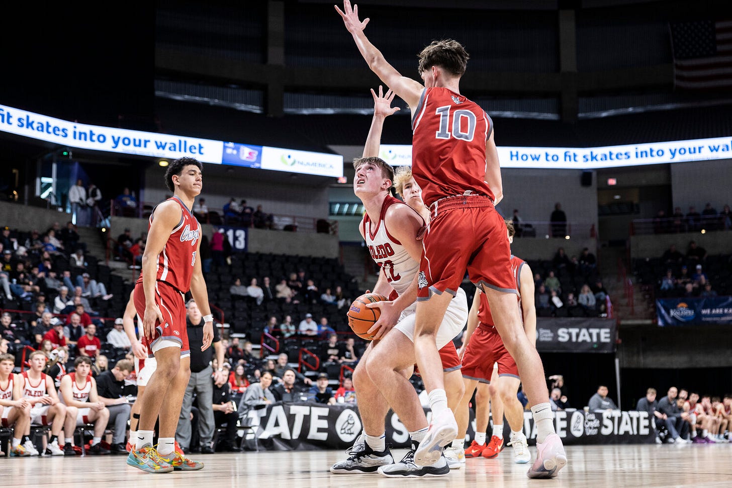 Okanogan’s Lucas Carlton (10) guards Toledo's Cooper Fallon (22) during a 2B Boys State Tournament Round of 12 game at the Spokane Arena on Wednesday, March 5.