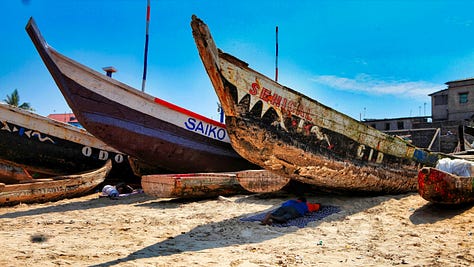 Canoes, boys, girls, pier at James in Accra, Ghana