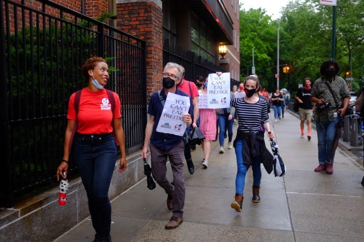 New Yorker Union members march down Sullivan Street. New Yorker Union members march down Sullivan Street.