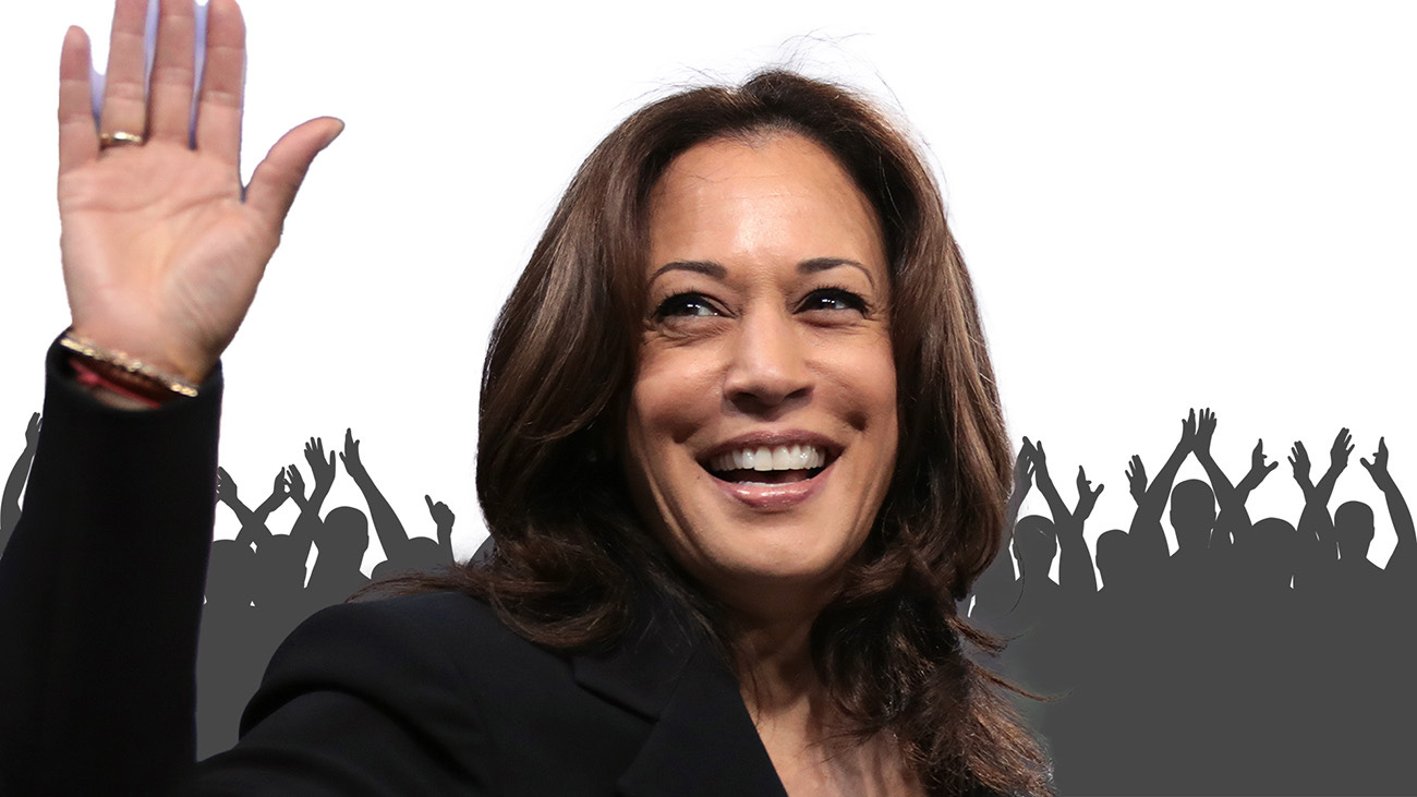 Kamala Harris waving with silhouette of cheering crowd behind her