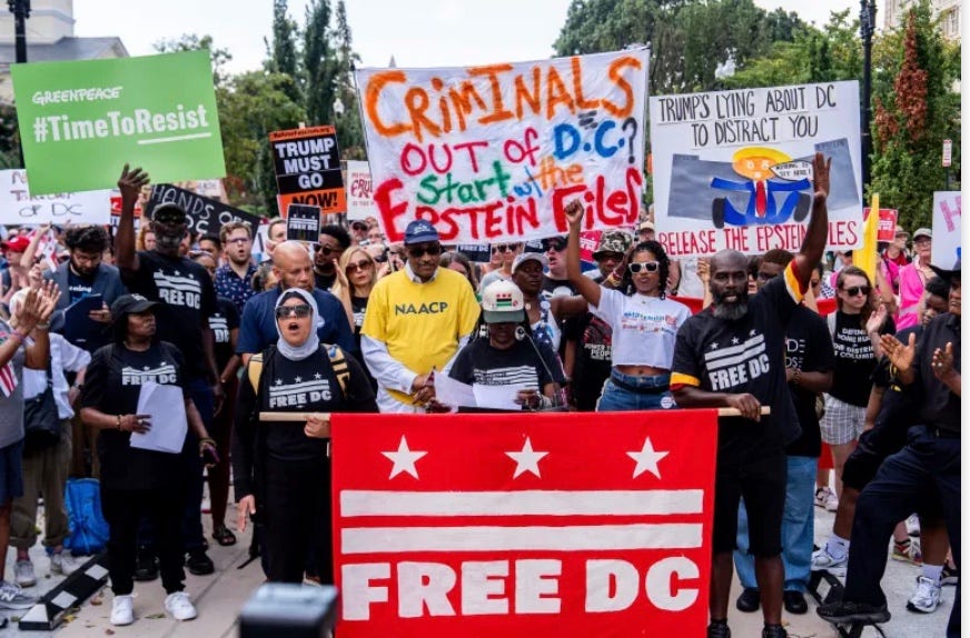 A group of people holding signs

AI-generated content may be incorrect.