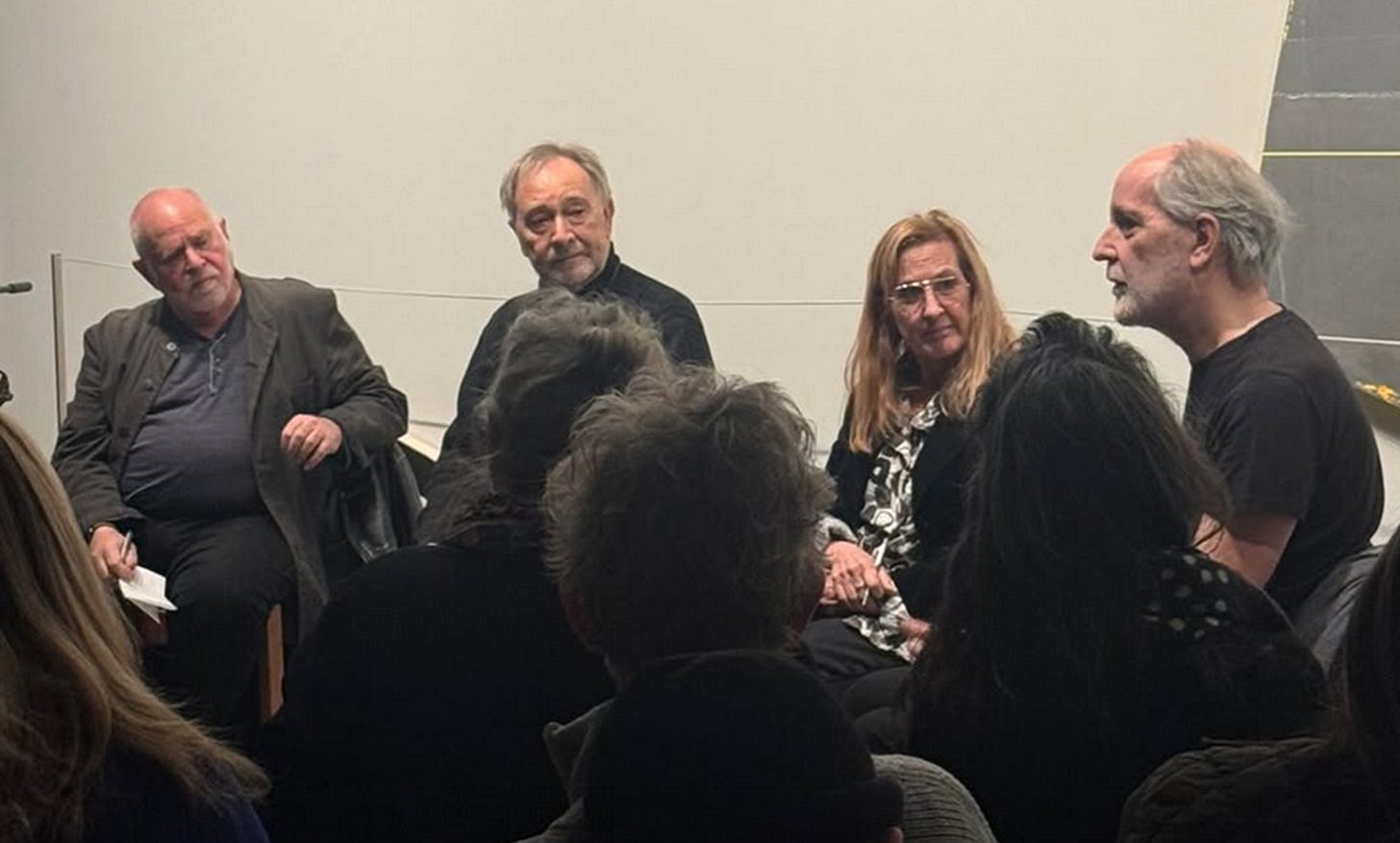 A group of people sitting in a circle

AI-generated content may be incorrect.