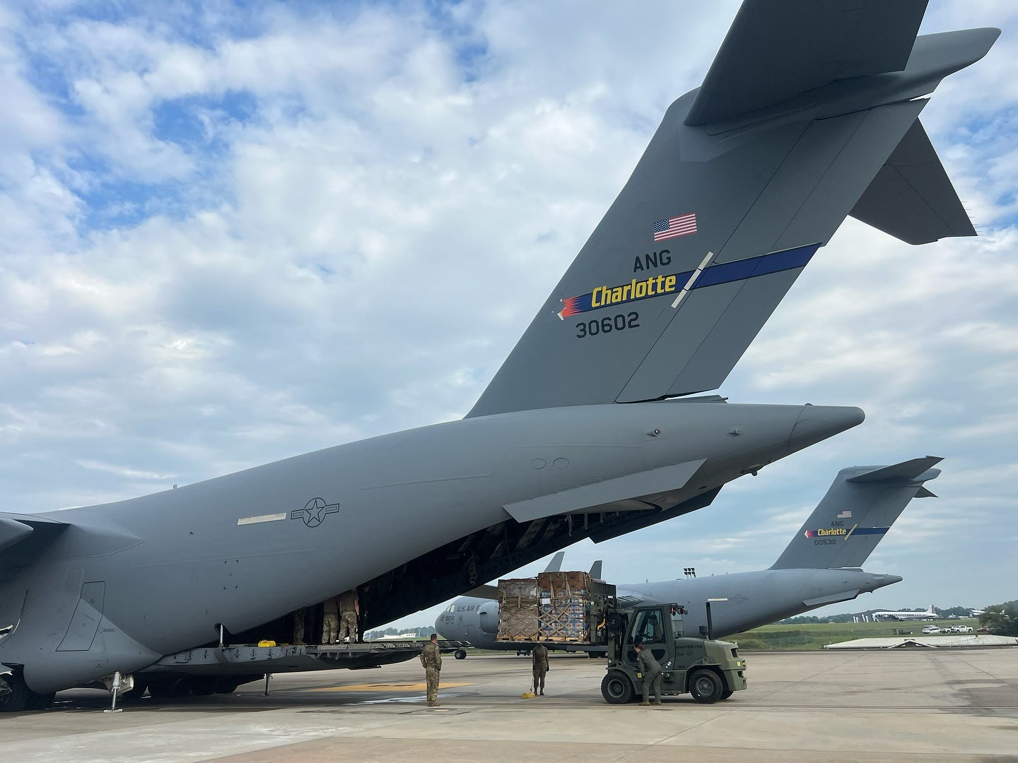 May be an image of 2 people and aircraft