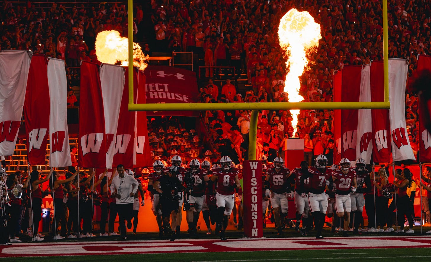 May be an image of football, fire, crowd and text