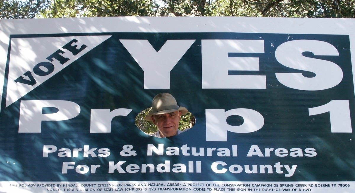 A person looking through a hole in a sign

AI-generated content may be incorrect.