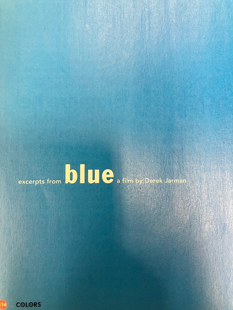Page from colors magazine. Blue background with the text: excerpts from blue a film by Derek Jarman. Blue is in much larger text. 