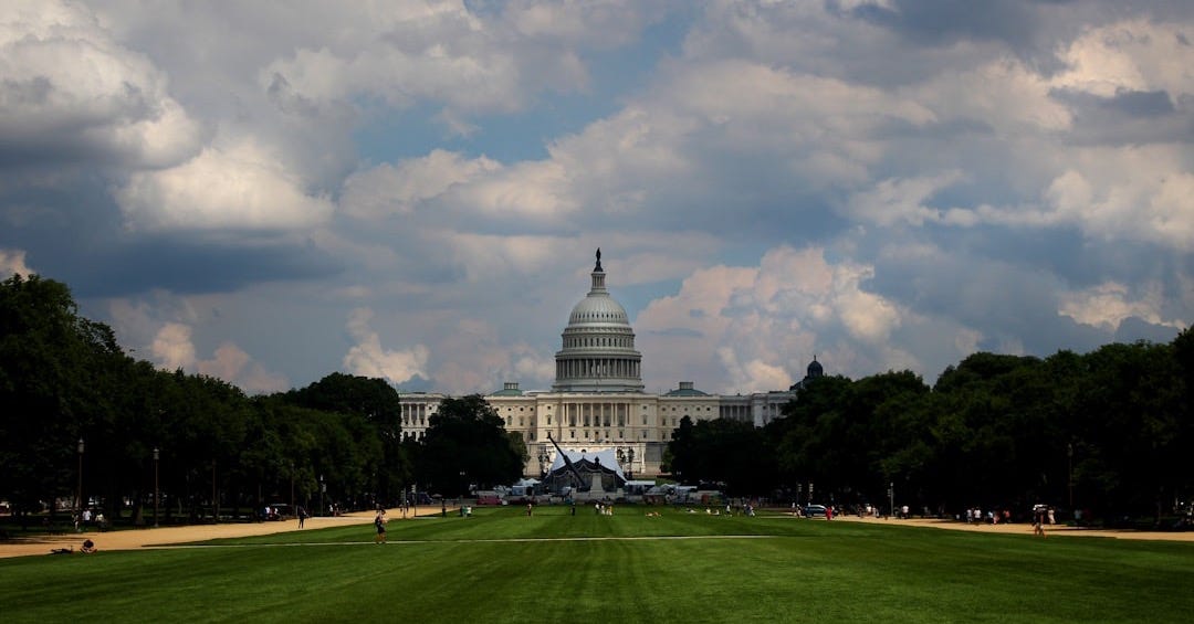 a view of the capitol building from across the lawn a view of the capitol building from across the lawn