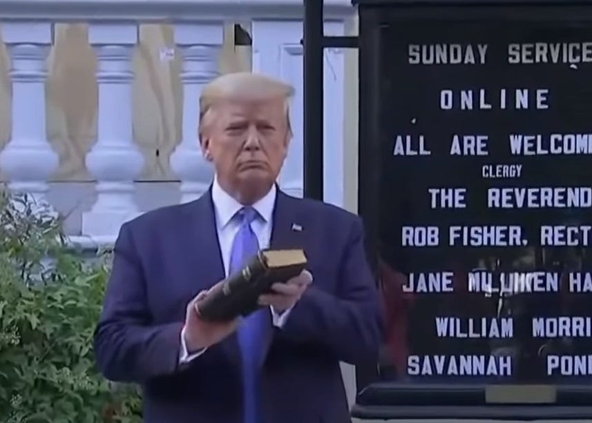 A scowling Donald Trump holds a bible while preparing for his photo shoot in front of St. John's Church in Washington DC, June 1, 2020 A scowling Donald Trump holds a bible while preparing for his photo shoot in front of St. John's Church in Washington DC, June 1, 2020