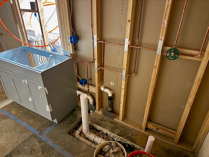 Photos of plumbing rough-in work.