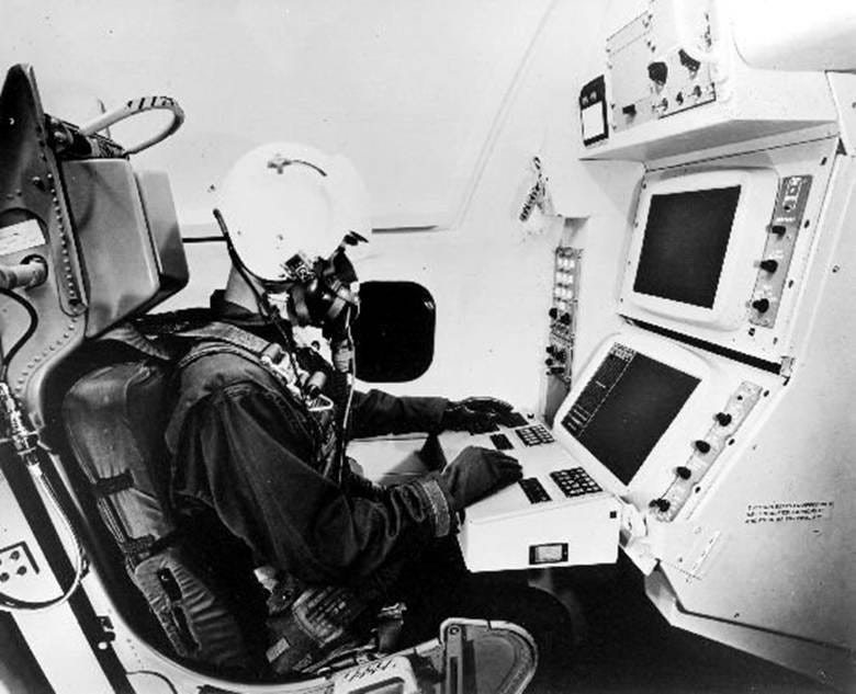 The image shows a pilot in a cockpit, operating controls and monitoring screens.

AI-generated content may be incorrect.