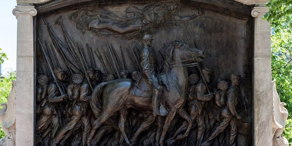 The bronze relief statue showing the soldiers of the 54th Massachusetts infantry marching, with Col. Robert Gould Shaw on horseback. The bronze relief statue showing the soldiers of the 54th Massachusetts infantry marching, with Col. Robert Gould Shaw on horseback.