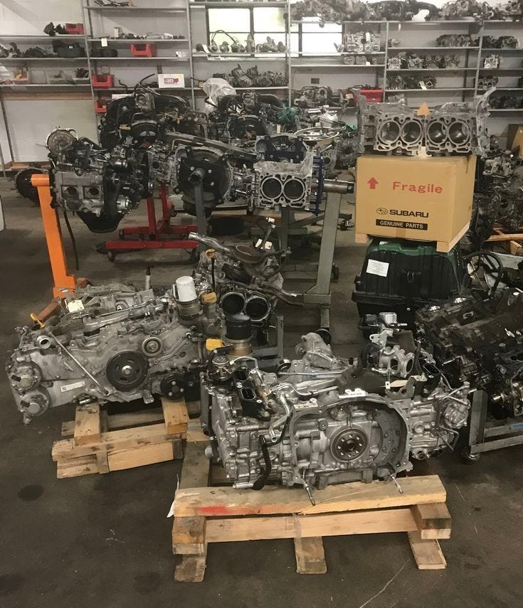 This may contain: several engines and parts are on display in a shop This may contain: several engines and parts are on display in a shop