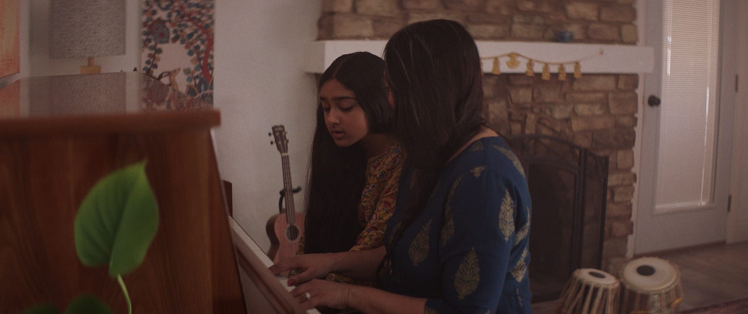 Lakshmi at piano.