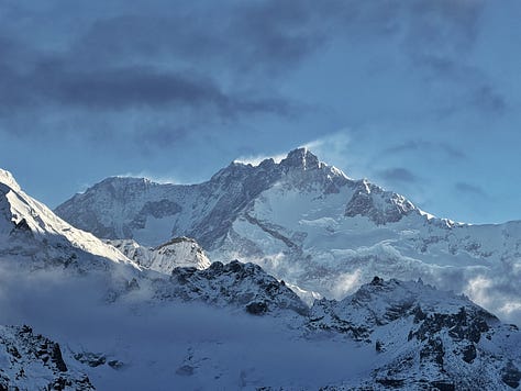 Images of the Himalayas and Alan crossing a glacier, and suspended down a crevasse