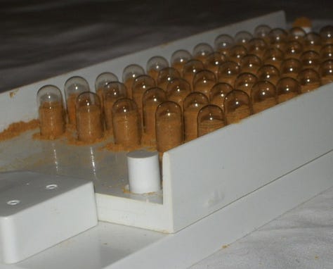 Capsules are separated and inserted in frame for filling