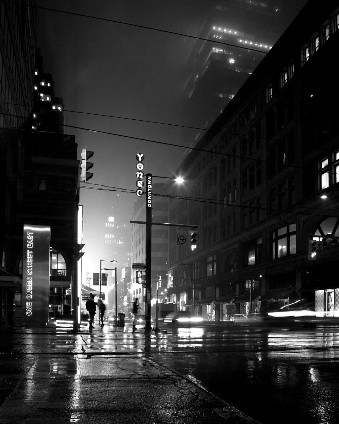 people standing near lamp post and building people standing near lamp post and building
