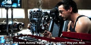 Sketches and diagrams splayed on the worktable. Tony finishes soldering  work on two sculpted metal boots. Monitors flicker... –  @irondad-and-spiderson on Tumblr