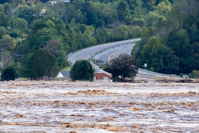 Flood waters from the Nolichucky River rage near Jackson Love Highway and Interstate 26 in Erwin, Tenn., on Friday Sept. 27, 2024.