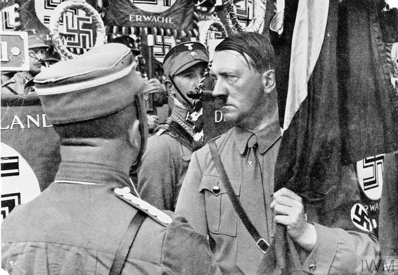 ADOLF HITLER FROM THE GERMAN CIGARETTE CARD COLLECTORS’ SERIES ‘ADOLF HITLER’ AND ‘DEUTSCHLAND ERWACHT’ 1934 - 1935. Credit: IWM (MH 11051)