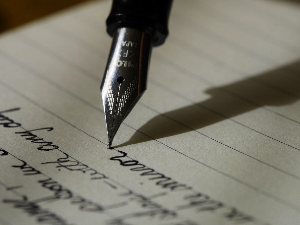 fountain pen on black lined paper fountain pen on black lined paper