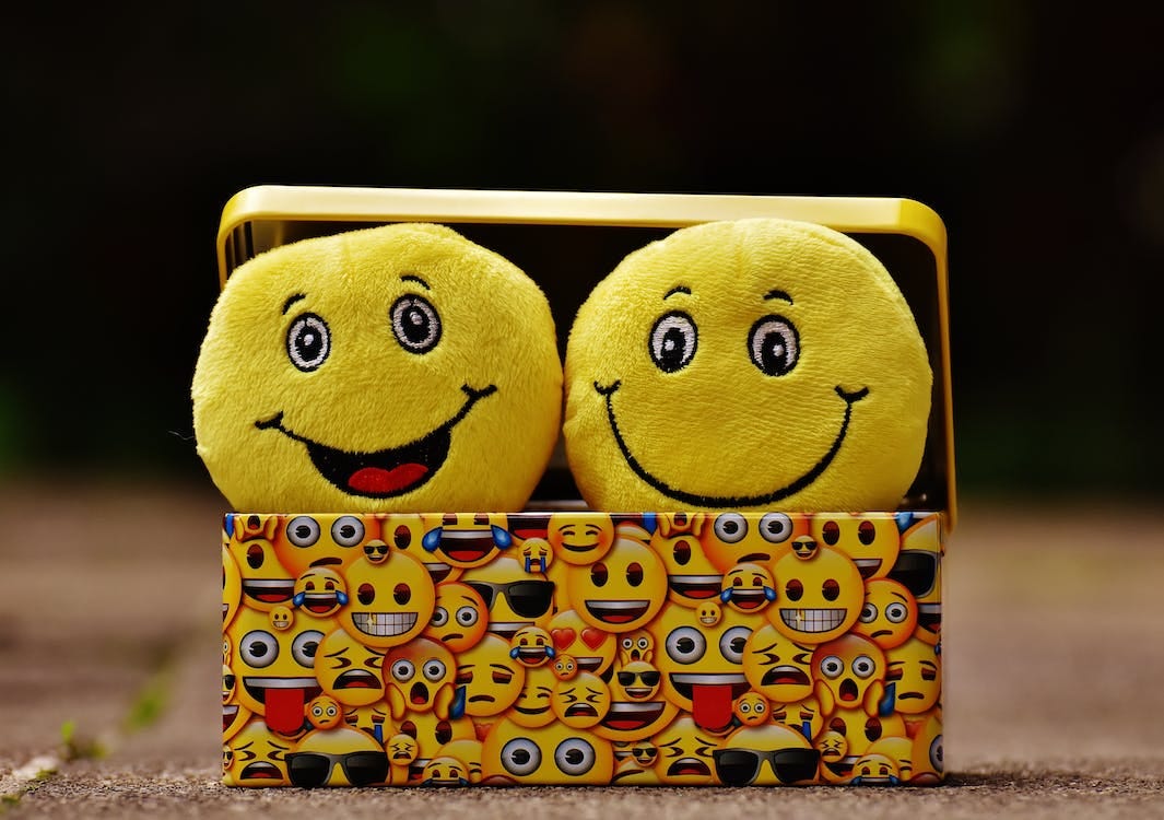 Free Two Yellow Emoji on Yellow Case Stock Photo Free Two Yellow Emoji on Yellow Case Stock Photo