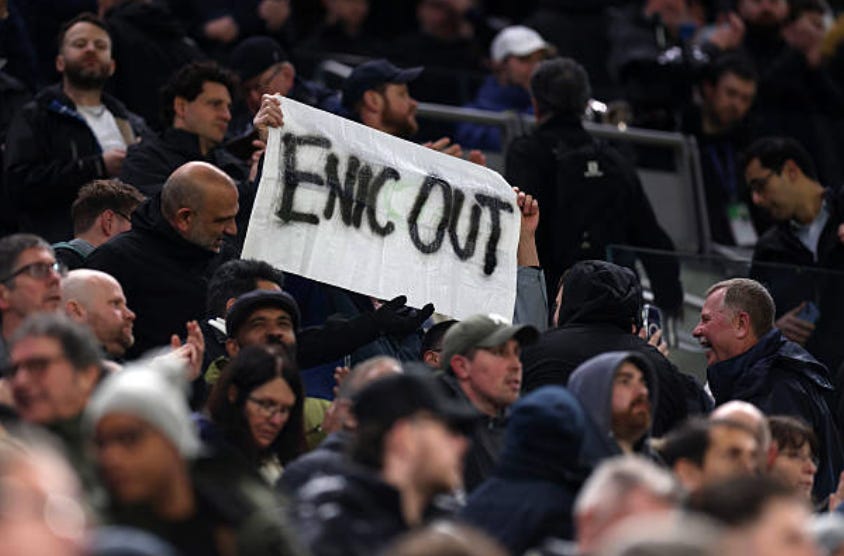 LONDON, ENGLAND - FEBRUARY 10: Tottenham Hotspur fans hold up banners saying ENIC OUT in protest against the clubs owners during the Premier League match between Tottenham Hotspur and Newcastle United at Tottenham Hotspur Stadium on February 10, 2026 in London, England. (Photo by Catherine Ivill - AMA/Getty Images)