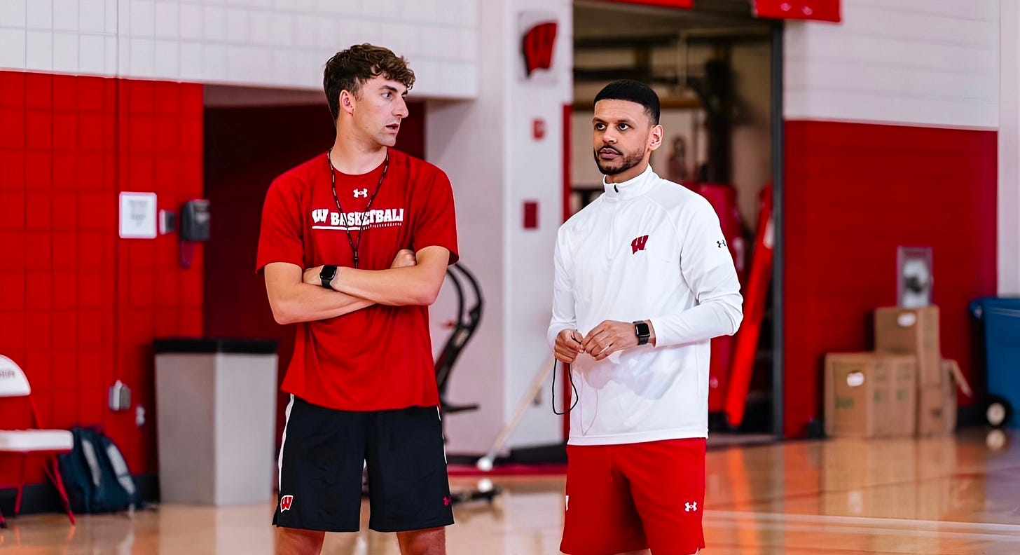 Eli Wilke, Wisconsin Basketball Operations Coordinator, standing next to Director of Recruiting and Scouting Isaac Wodajo. Eli Wilke, Wisconsin Basketball Operations Coordinator, standing next to Director of Recruiting and Scouting Isaac Wodajo.