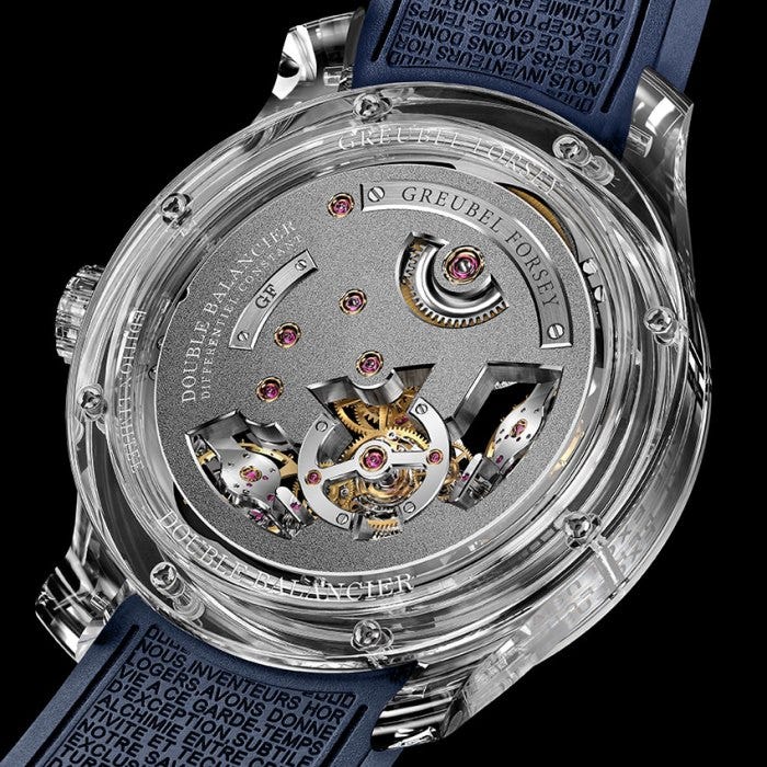 Greubel Forsey’s watchmaking philosophy is engraved around the flanks of the movement and emblazoned on the inside of the rubber strap. Greubel Forsey’s watchmaking philosophy is engraved around the flanks of the movement and emblazoned on the inside of the rubber strap.