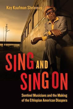 A book cover featuring a photo of a man in a suit and hat looking out from a train.