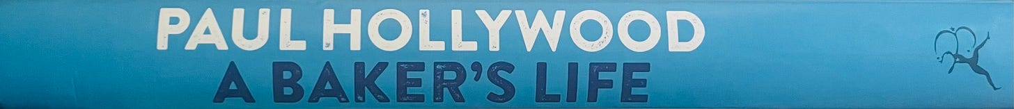 Book spine of A Baker's Life by Paul Hollywood. Bright blue cover.