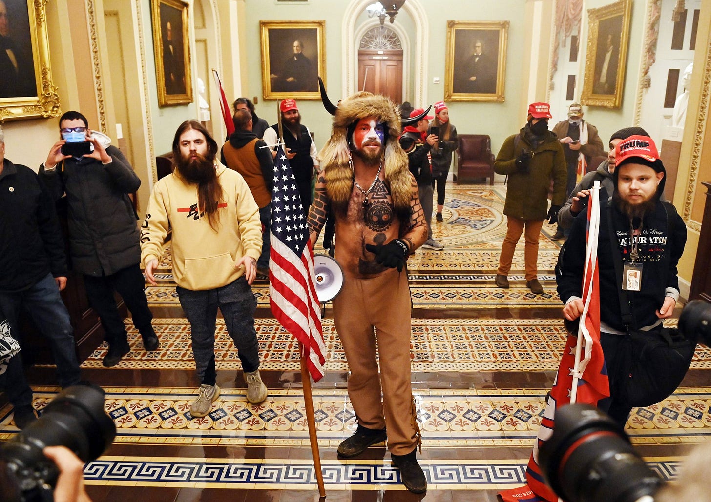 Supporters of US President Donald Trump enter the US Capitol on January 6, 2021, in Washington, DC. - Demonstrators breeched security and entered the Capitol as Congress debated the a 2020 presidential election Electoral Vote Certification. (Photo by Saul LOEB / AFP) (Photo by SAUL LOEB/AFP via Getty Images)