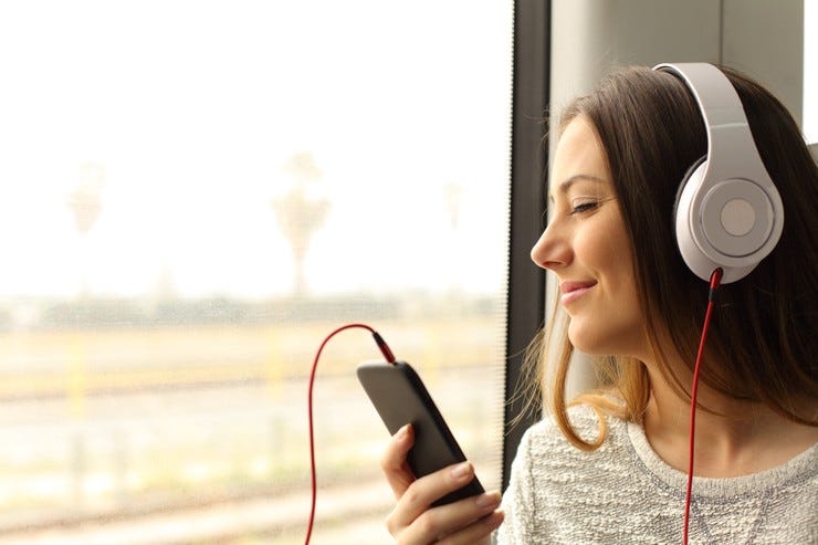 Young woman listening to music with headphones Young woman listening to music with headphones