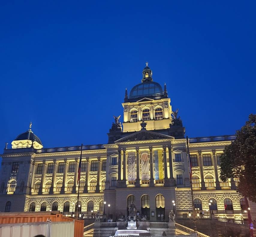 A large building with lights on it with National Museum in the background

AI-generated content may be incorrect.