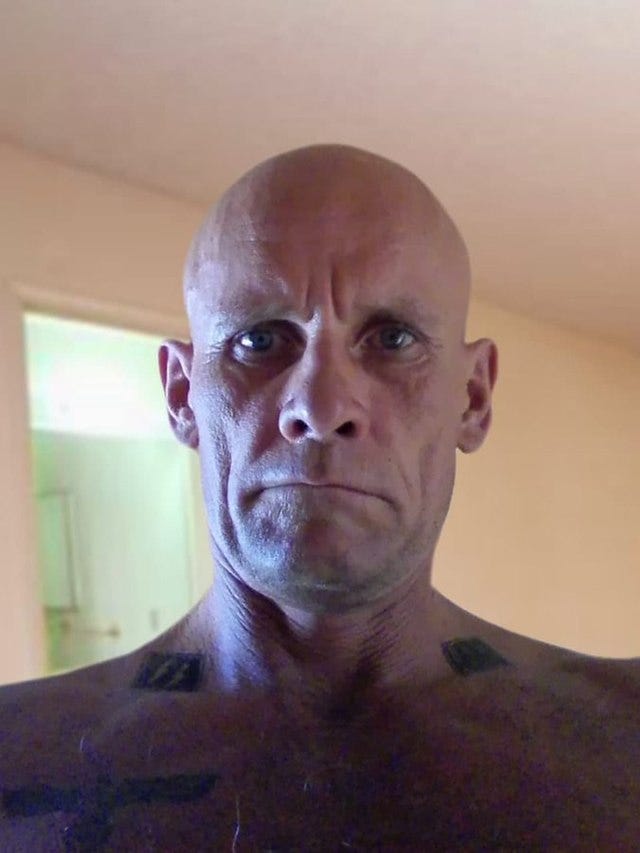 Dmitry Utkin, alleged commander of Russia's Wagner proxy, with Nazi tattoos clearly visible 