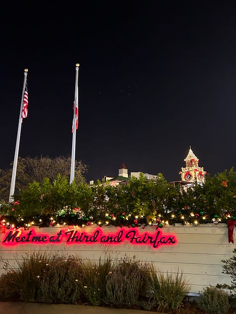 the original farmers market sign, a sign that says meet me at third and fairfax, and the view inside of the stalls