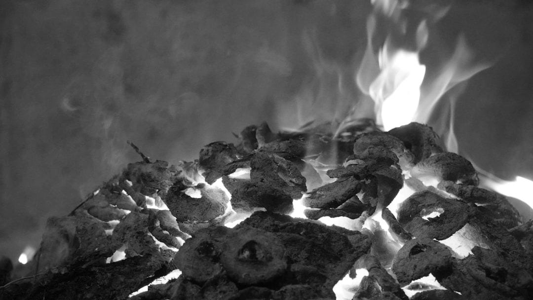 A pile of wood burning intensely with bright flames.