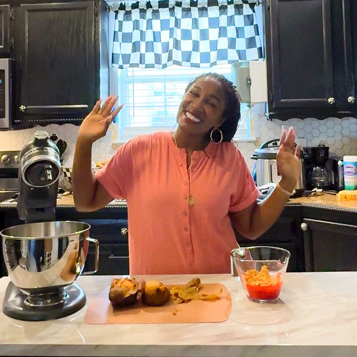 Behind-the-scenes of The Soul Food Pot® cookbook photoshoot showing Shaunda Necole mixing ingredients in a home kitchen while being filmed, capturing modern soul food recipe creation and storytelling