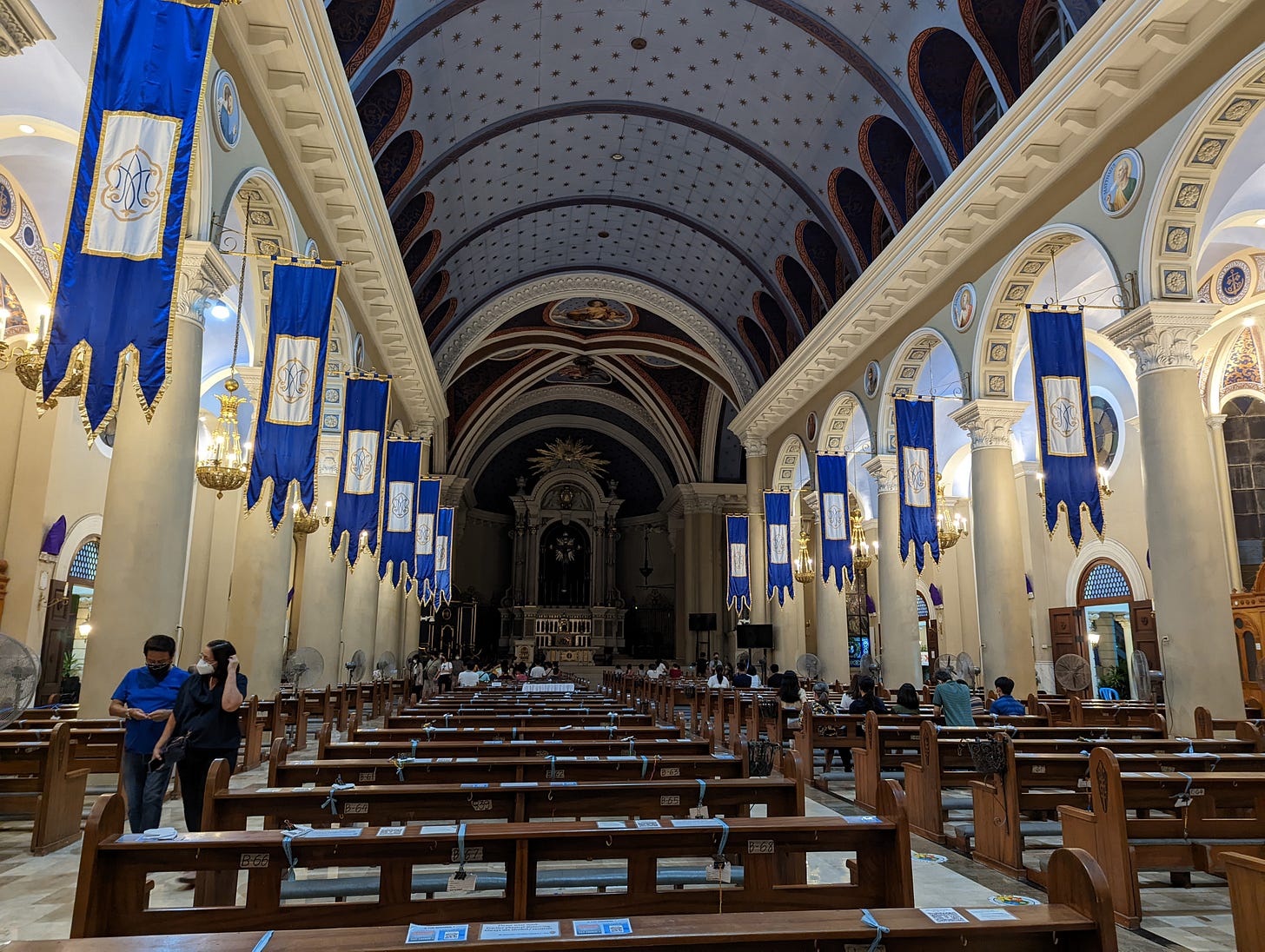 The interior of the Cathedral of Cubao showcasing its grand design and cream-colored interior