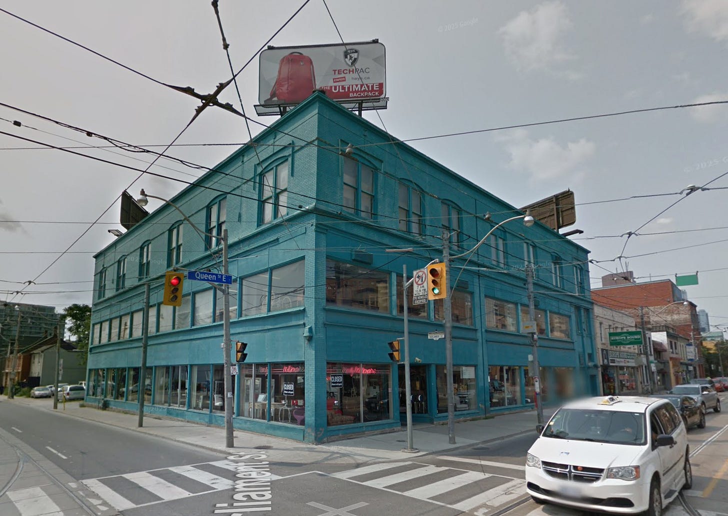 A building at Queen & Parliament in 2014. It is dark green with a neon sign in the windows reading "Marty Millionaire." A building at Queen & Parliament in 2014. It is dark green with a neon sign in the windows reading "Marty Millionaire."