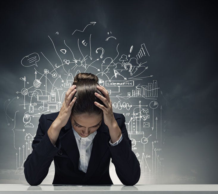 Young crying businesswoman with hands on head - anxious, overwhelmed