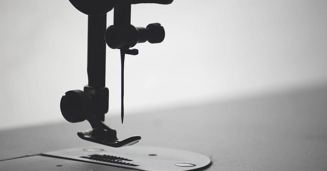 macro photography of sewing needle