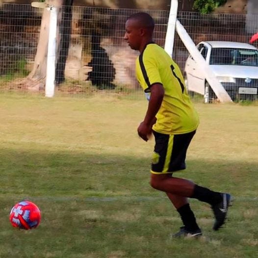 May be an image of 1 person, playing football, playing soccer and grass