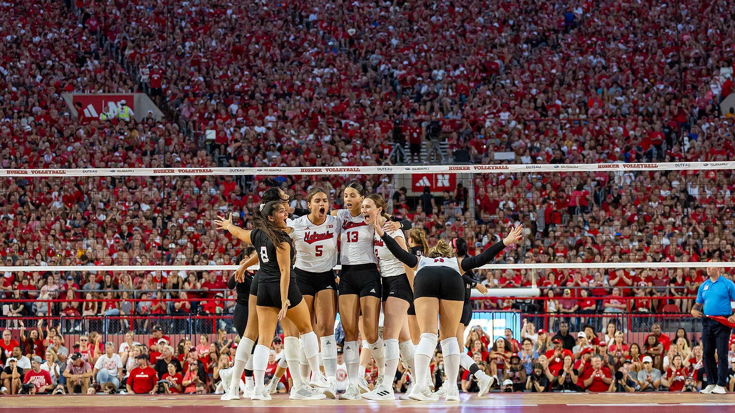 Nebraska volleyball celebrates a point in front of a world-record crowd at Memorial Stadium Aug. 30 Nebraska volleyball celebrates a point in front of a world-record crowd at Memorial Stadium Aug. 30