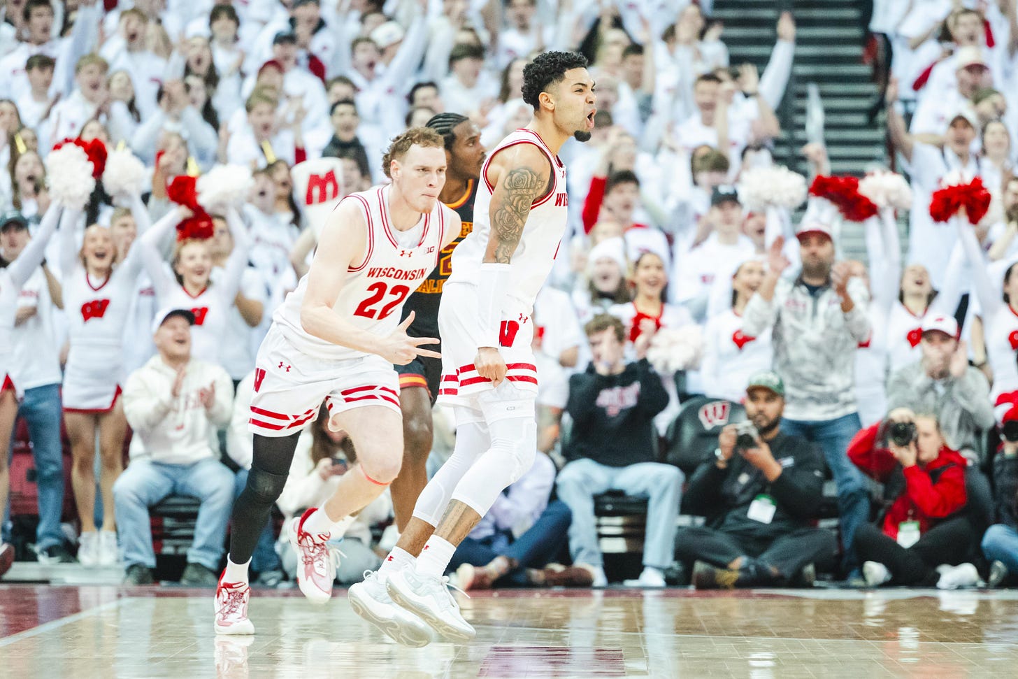 Wisconsin basketball guard Nick Boyd jumps in the air while his teammate Austin Rapp runs behind him in transition on defense Wisconsin basketball guard Nick Boyd jumps in the air while his teammate Austin Rapp runs behind him in transition on defense