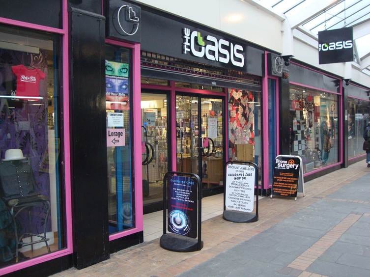 A storefront with a sign

AI-generated content may be incorrect.