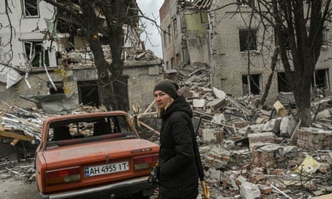 A woman stands in front of a destroyed building after a deadly strike in the city of Sloviansk yesterday. A woman stands in front of a destroyed building after a deadly strike in the city of Sloviansk yesterday.