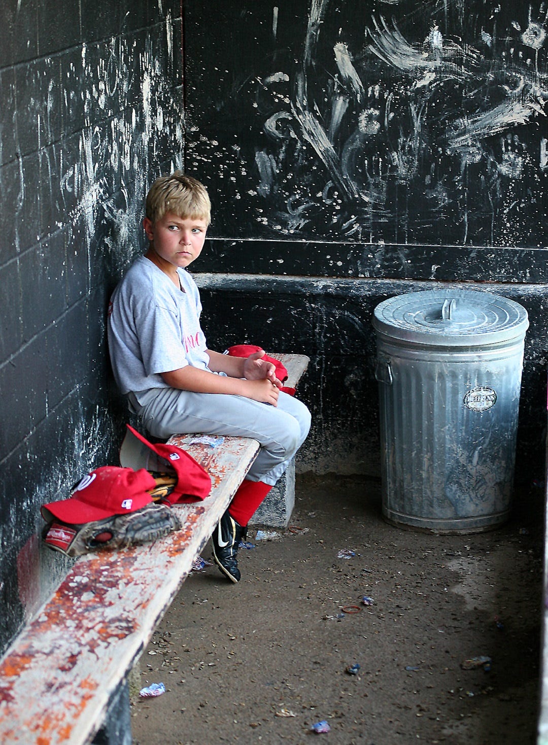 “Put me in, coach!” The words from the John Fogarty songs Centerfield always come to mind when I see this photo of a young player waiting his turn to get in the game. Left in the dugout while his team battles for a win, this kid waited patiently and cheered his teammates on, in spite of his not playing at that moment.