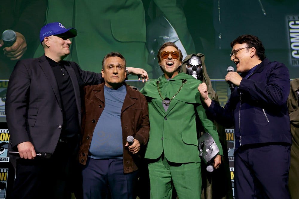 SAN DIEGO, CALIFORNIA - JULY 27: (L-R) Kevin Feige, President, Marvel Studios, Joe Russo, Robert Downey Jr. and Anthony Russo speak onstage during the Marvel Studios Panel in Hall H at SDCC in San Diego, California on July 27, 2024. (Photo by Jesse Grant/Getty Images for Disney)