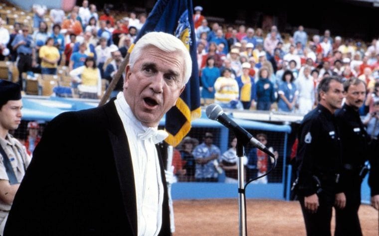 Leslie Nielsen sings the national anthem in "The Naked Gun."