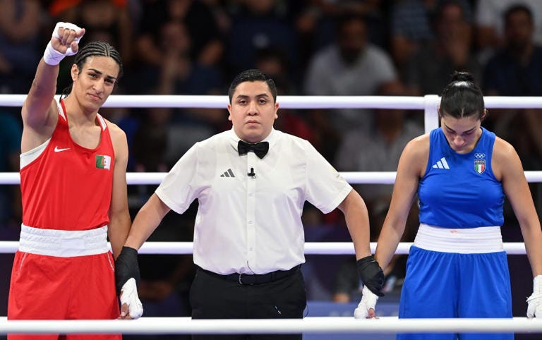 Italy's Angela Carini (right) abandoned her bout with Algeria's Imane Khelif after 46 seconds with a suspected broken nose - Fabio Bozzani/Anadolu/Getty Images